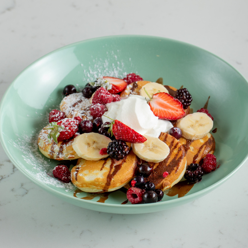 Pancakes with banana and berries